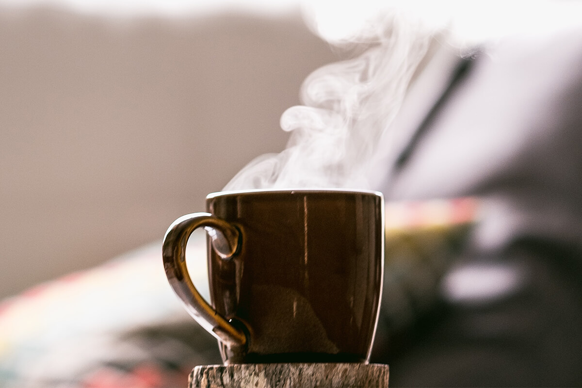 Photo of steaming hot coffee mug