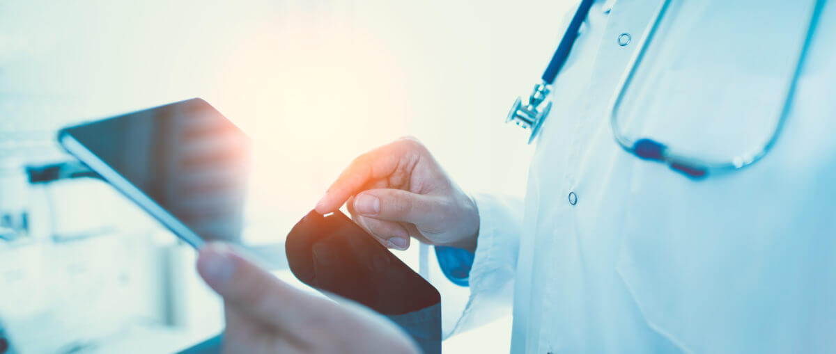 Photo of physician using a tablet