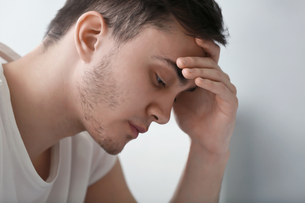 Photo of a stressed young man