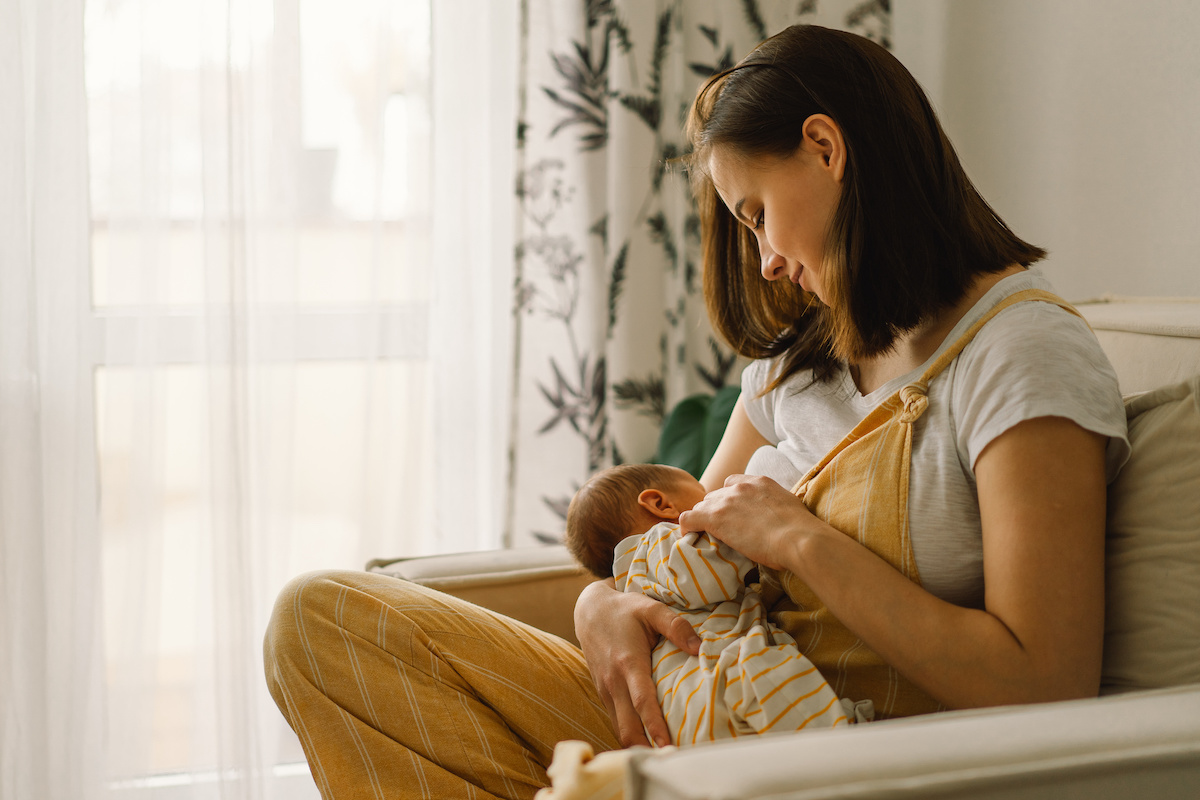 Photo of mother breastfeeding newborn baby