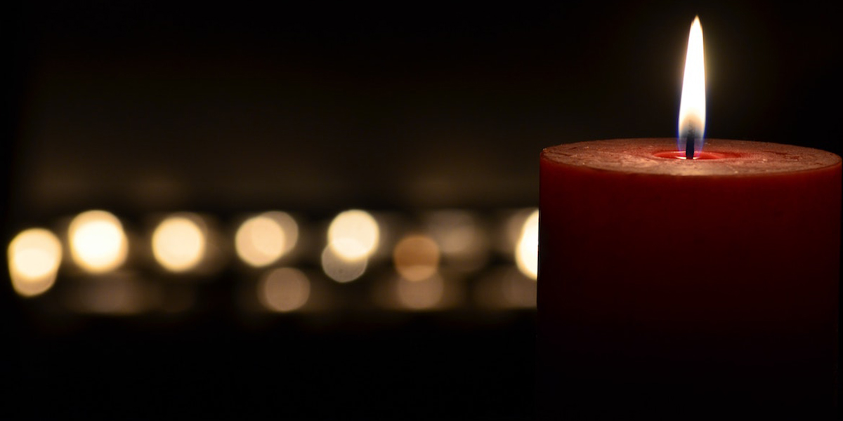 Photo of a lit candle