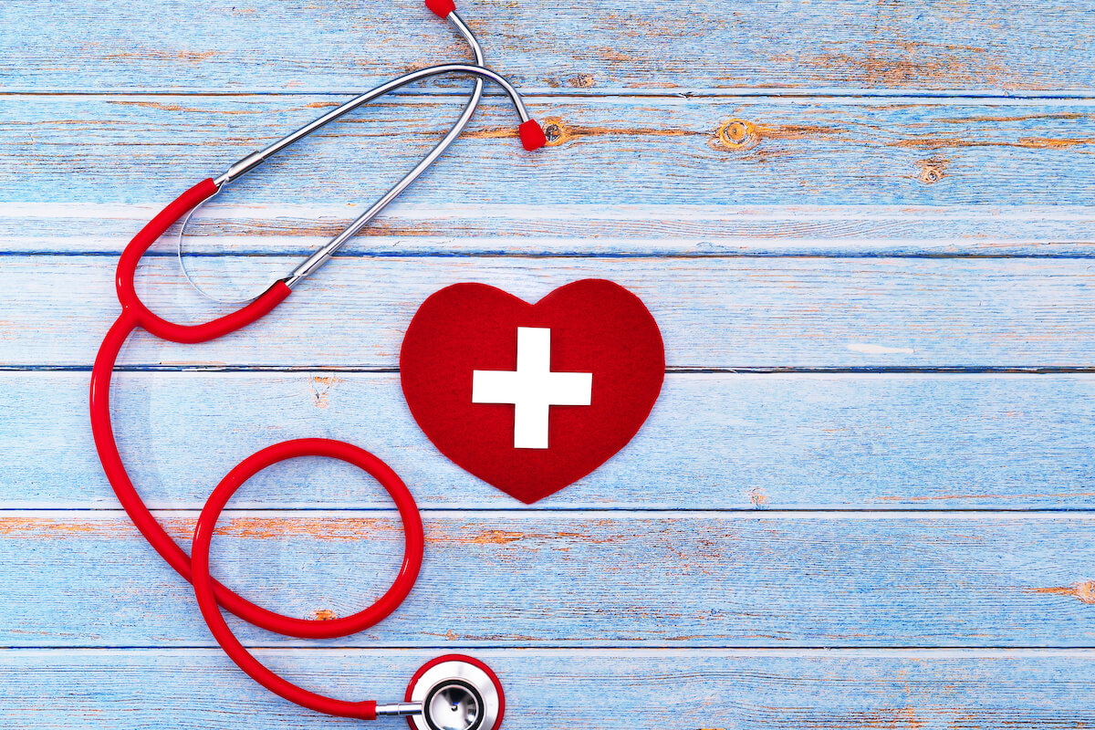 Image with a stethoscope and a medical red cross in a heart
