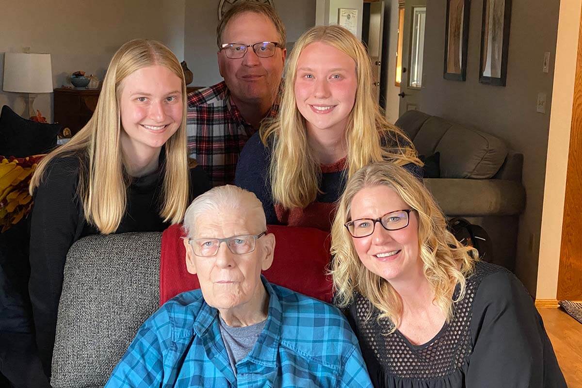 Photo of Joy Plamann with her dad and family 