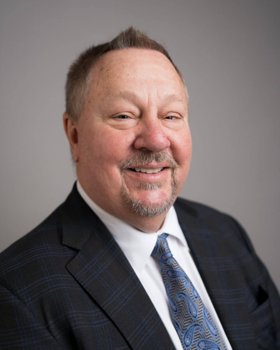Portrait of CEO Ken Holmen, MD