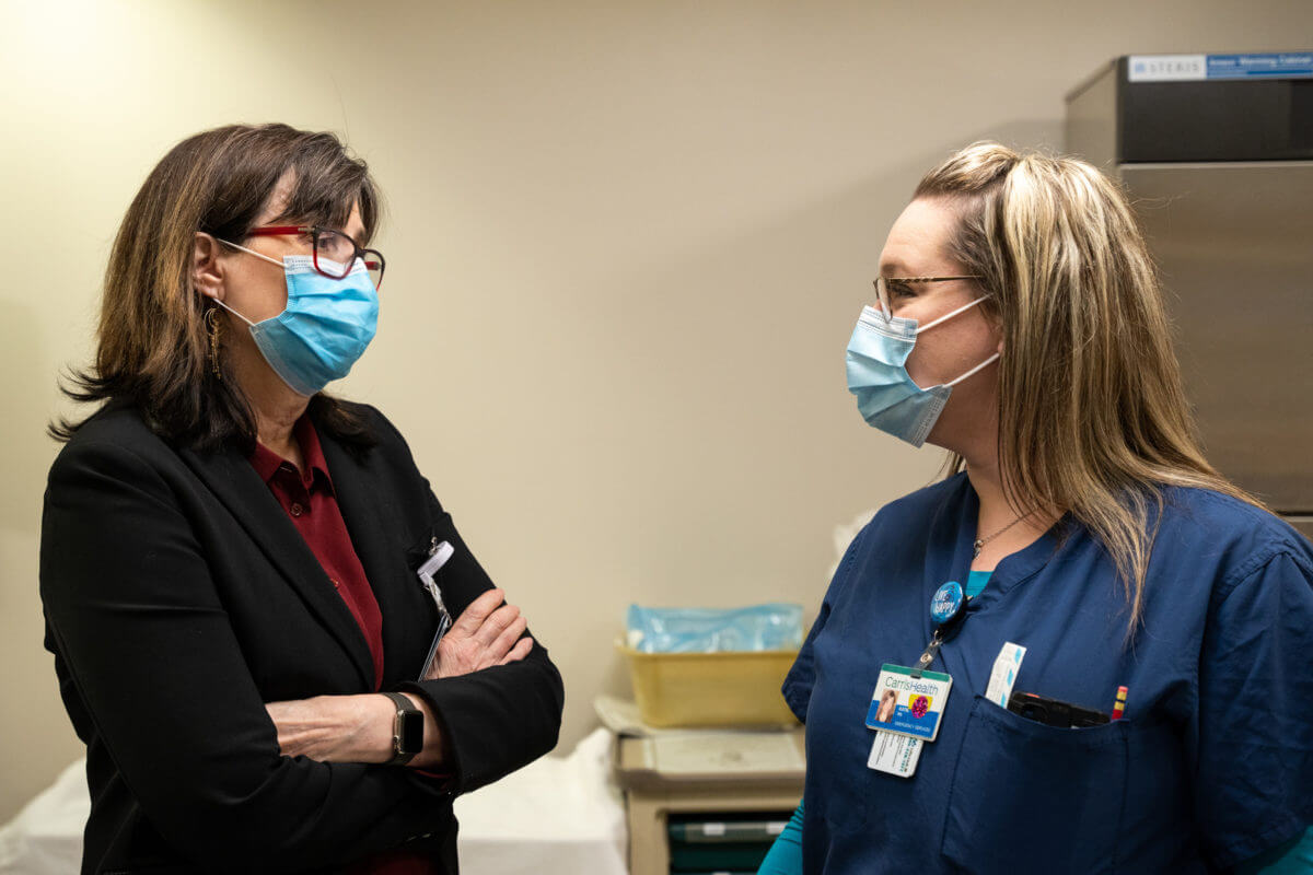 Photo of Cindy Firkins Smith MD rounding with a nurse at Rice Memorial