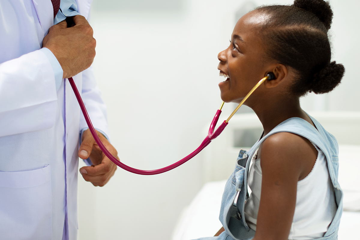 Black girl with physician