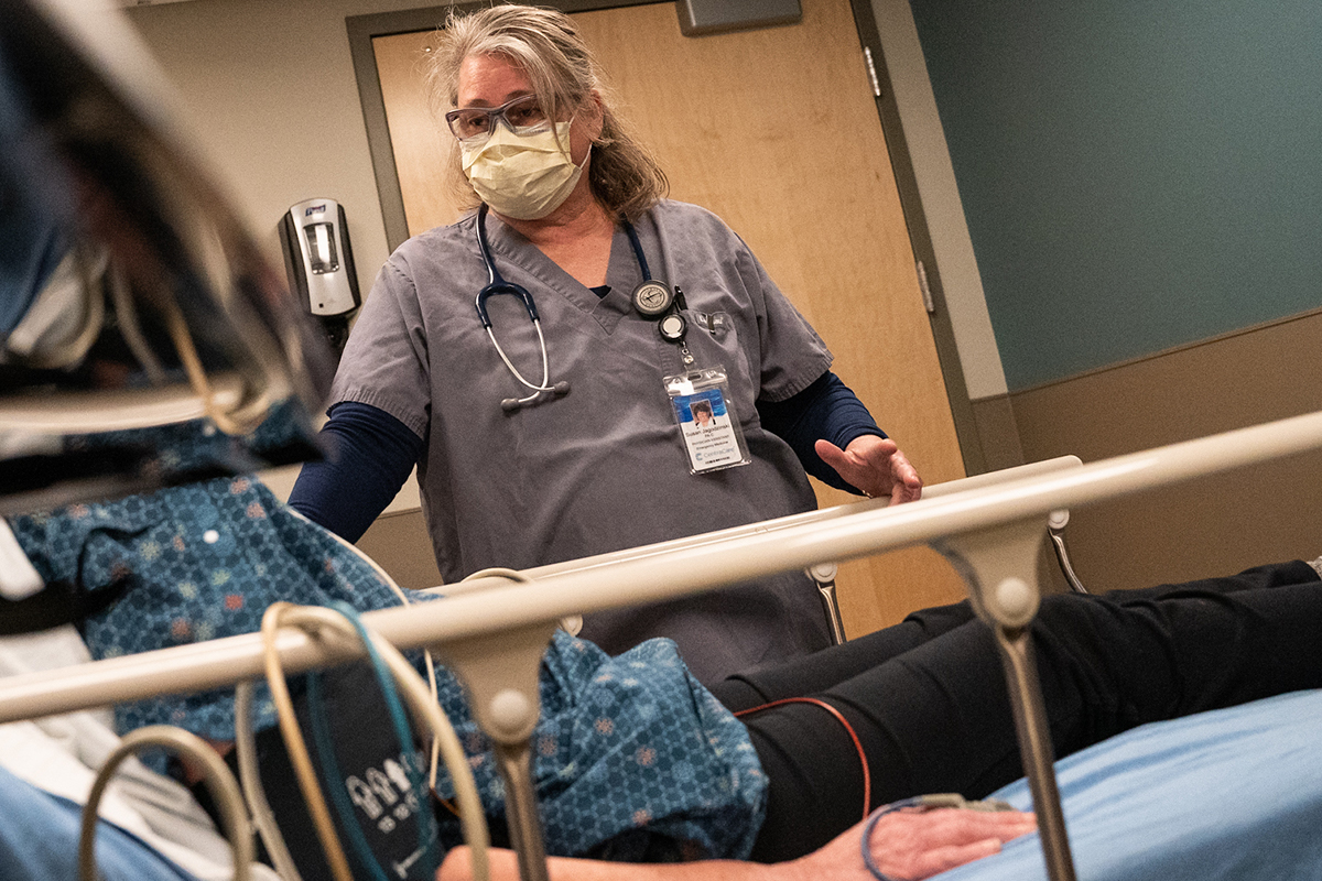 Photo of RN Sue Jagodzinski at the bedside in Monticello