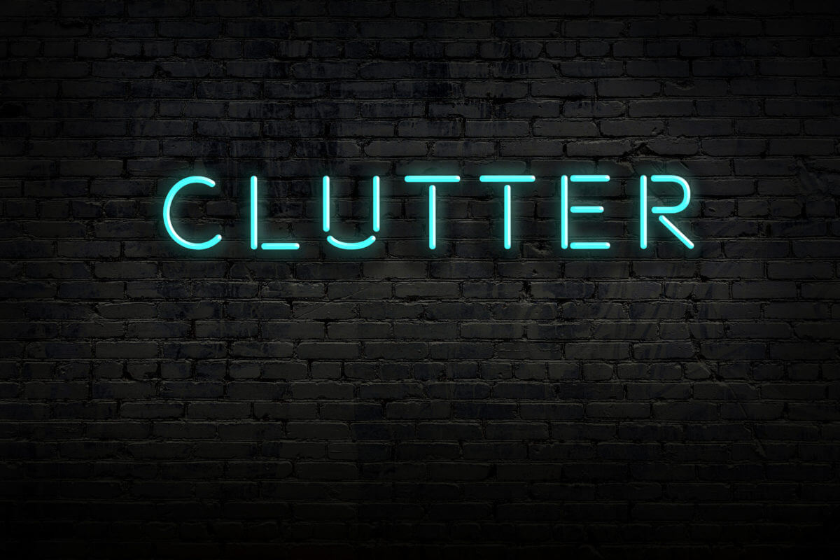 Photo of a neon sign that says Clutter