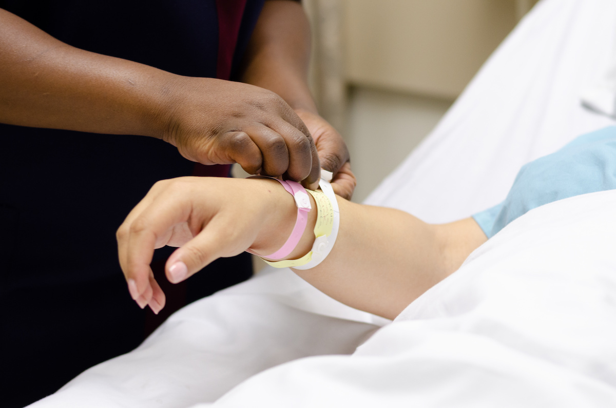 An image of a woman being admitted into hospital