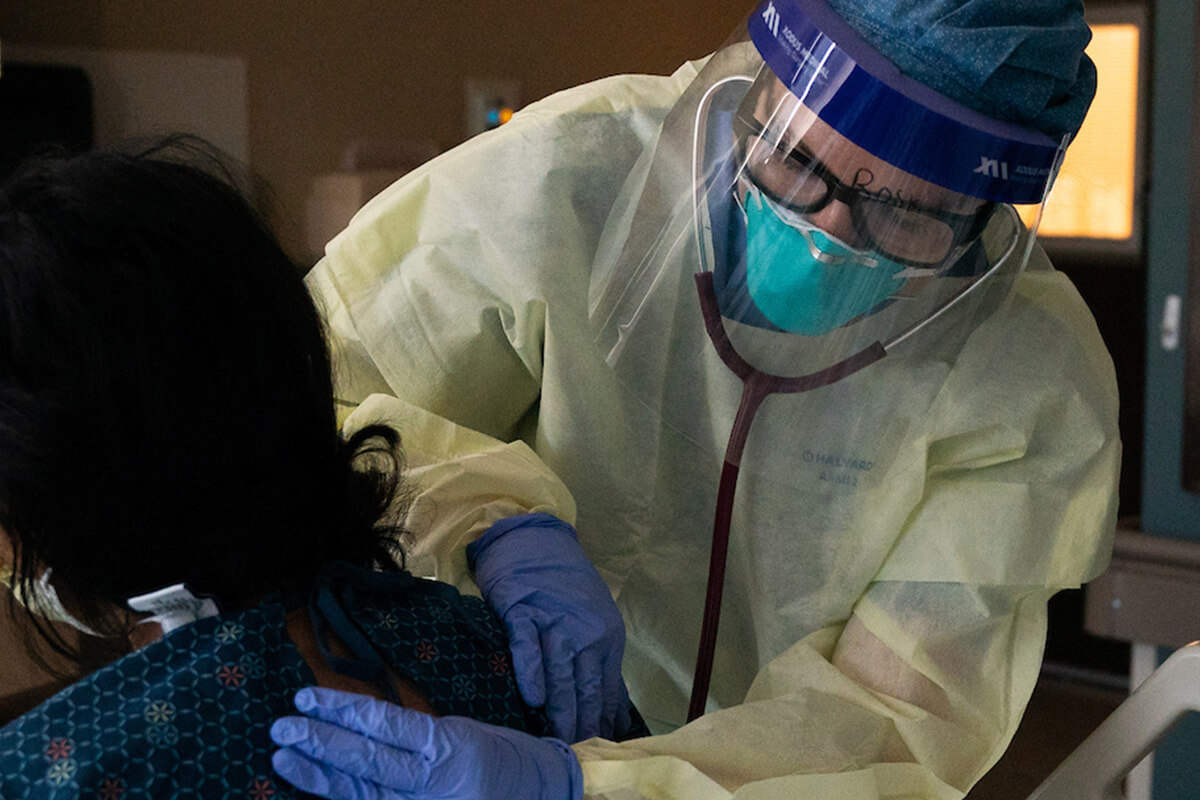 Photo of physician examining a patient