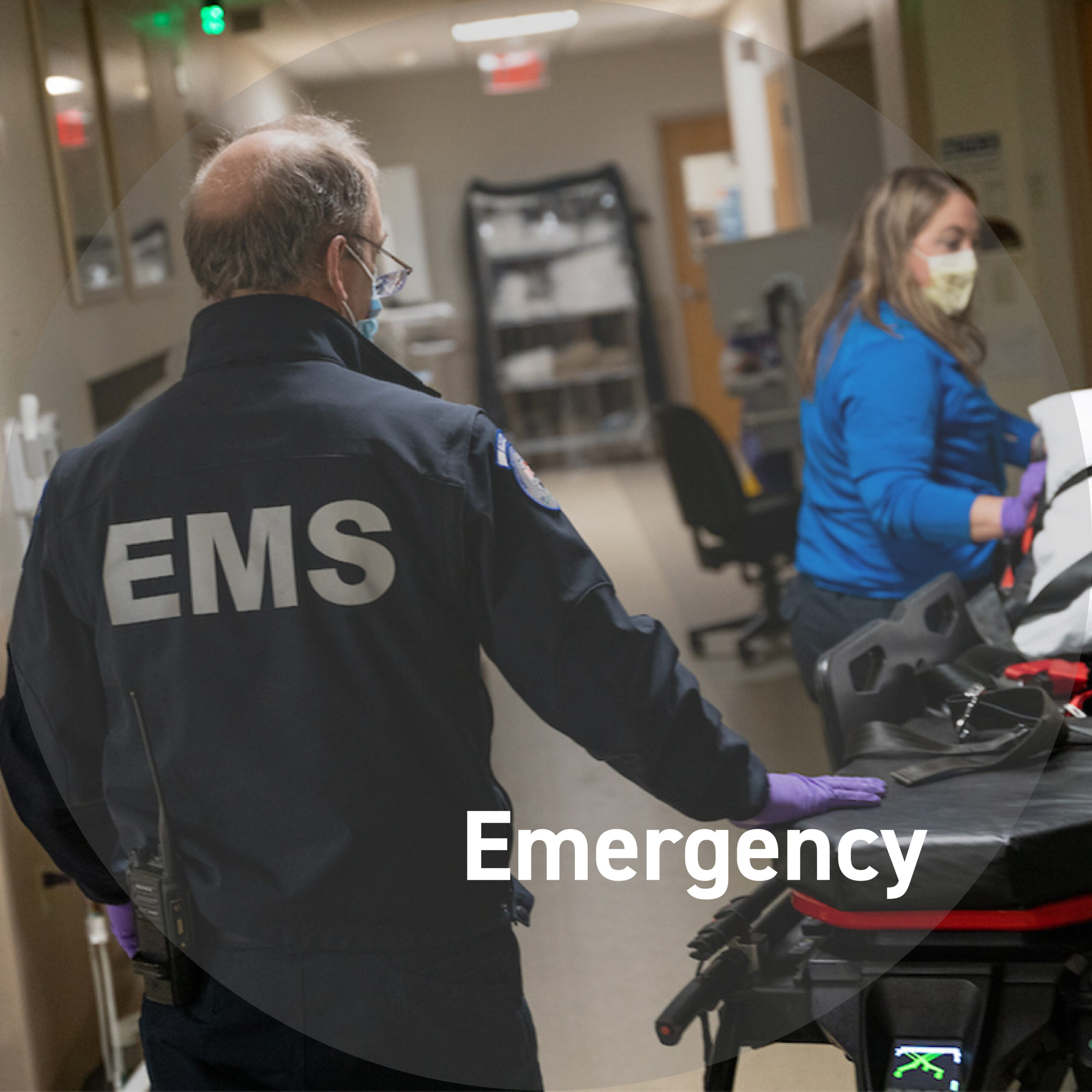 Photo of an EMS team member and a gurney in the ED