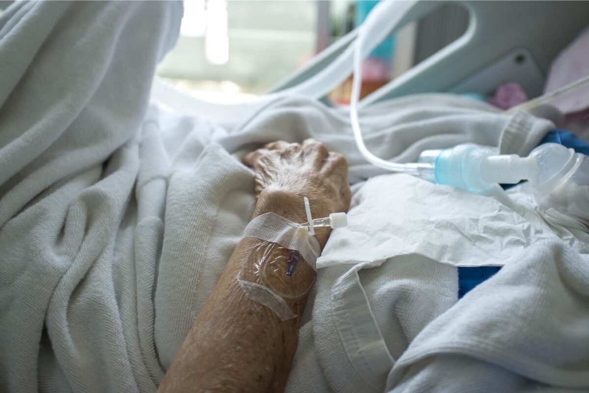 Photo of a hospital patient in bed