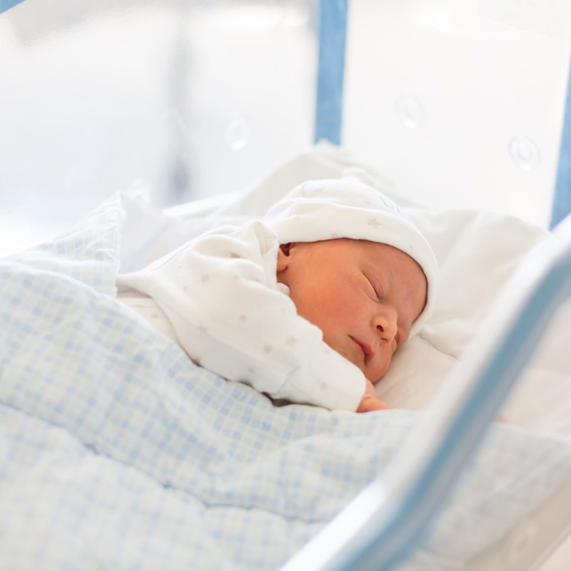Photo of a new born baby in a hospital nursery