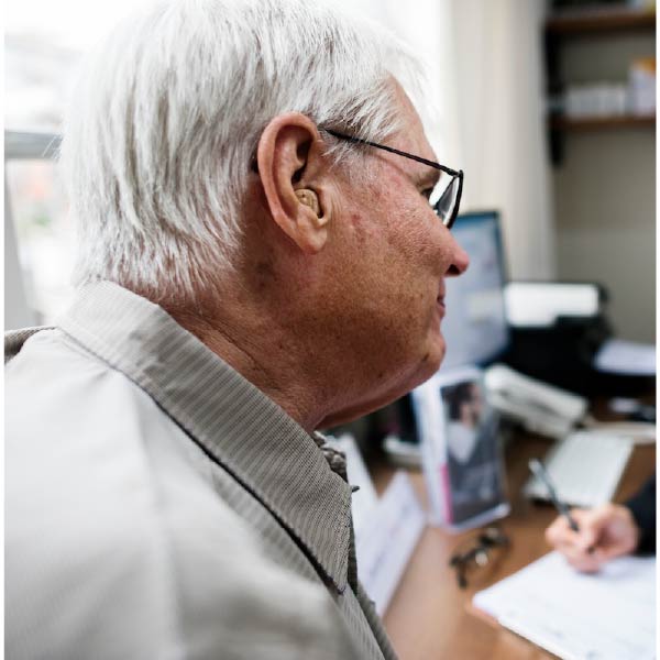 Photo of an elderly man with a physician