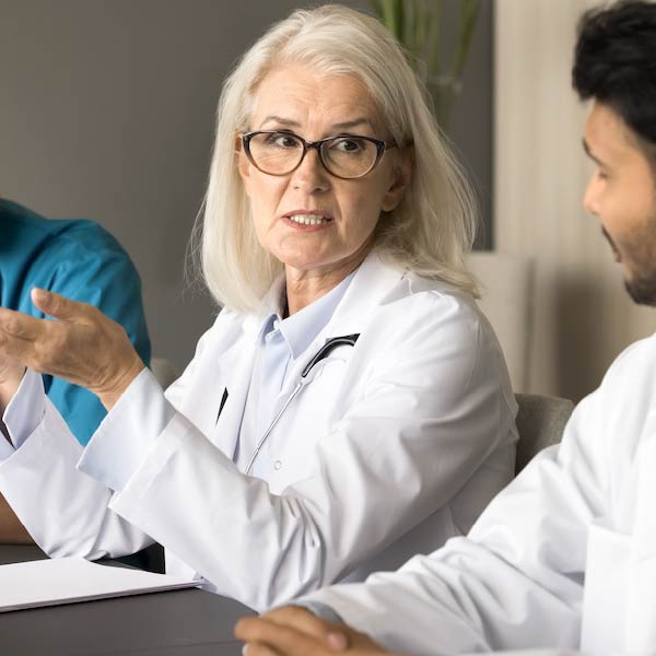 Photo of a doctor in a meeting teaching others