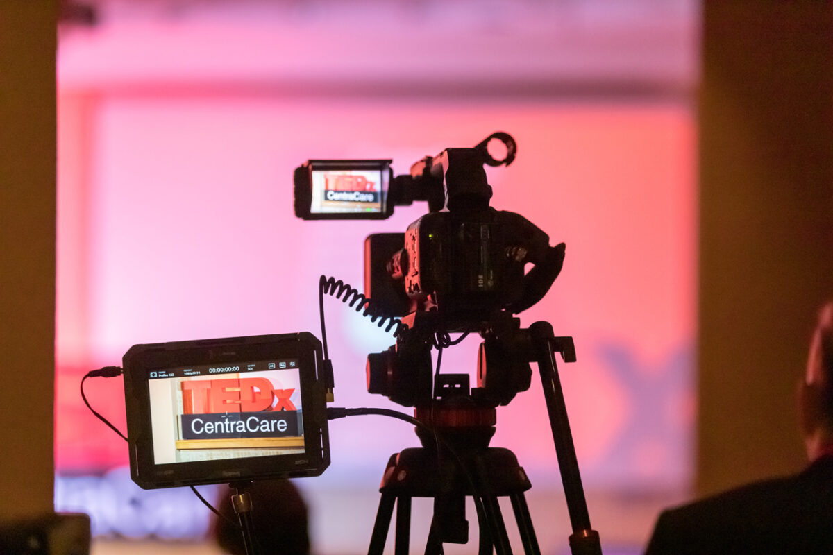 Photo of video camera at TEDxCentraCare capturing the stage