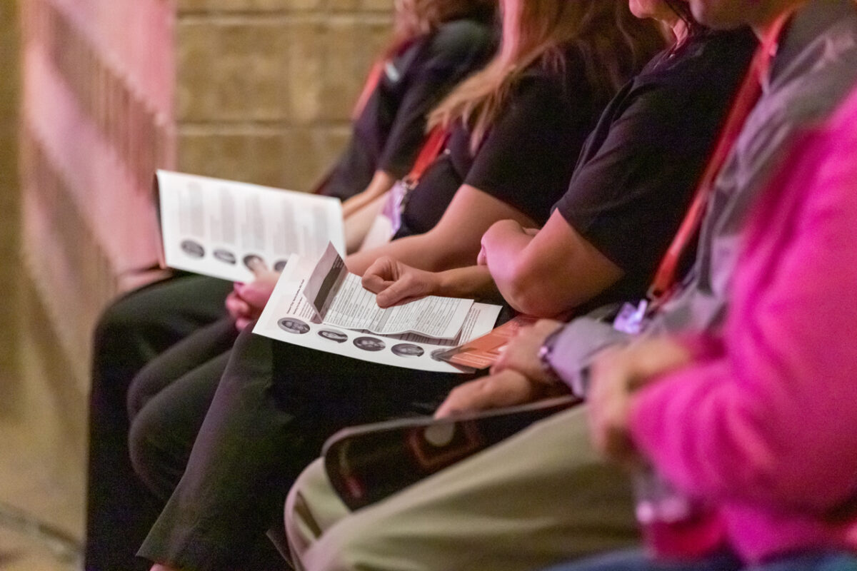 TEDxCentraCare attendees with programs