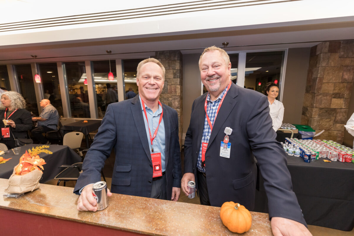 Dr. Holmen with a fellow physician at the TEDxCentraCare reception