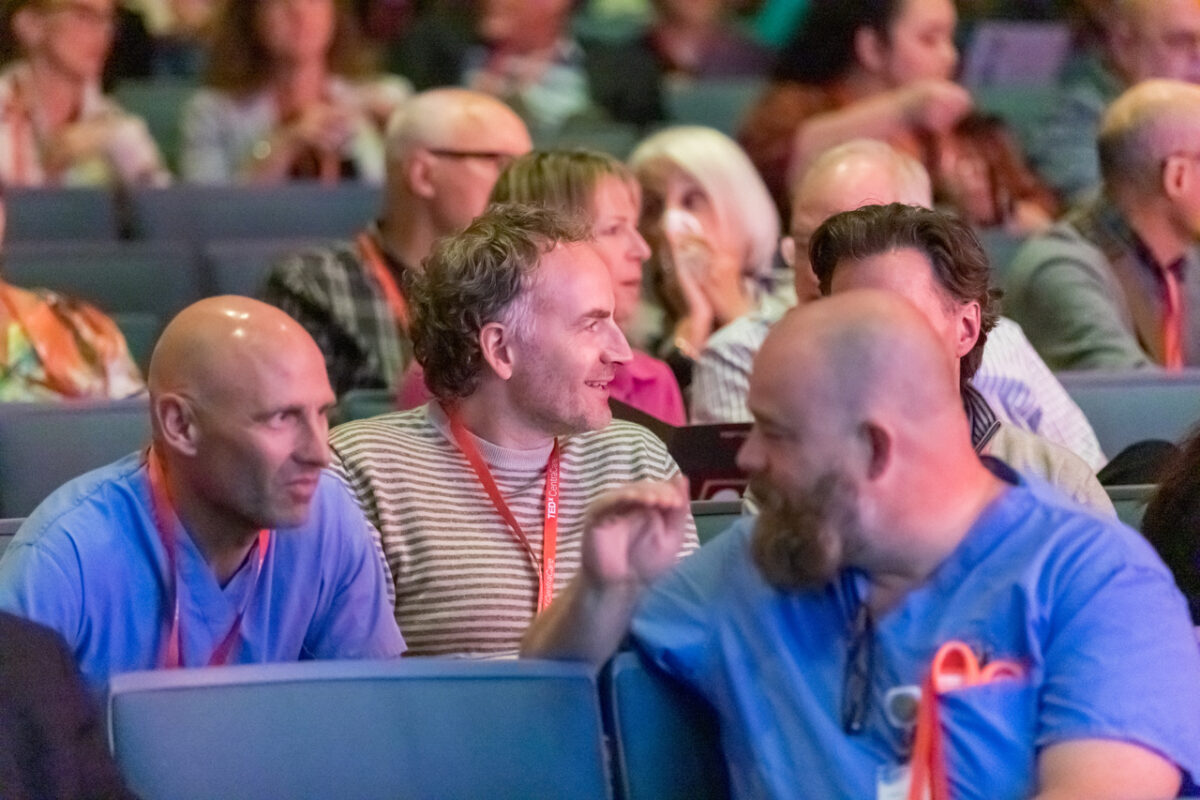 Colleagues chatting at the TEDxCentraCare event