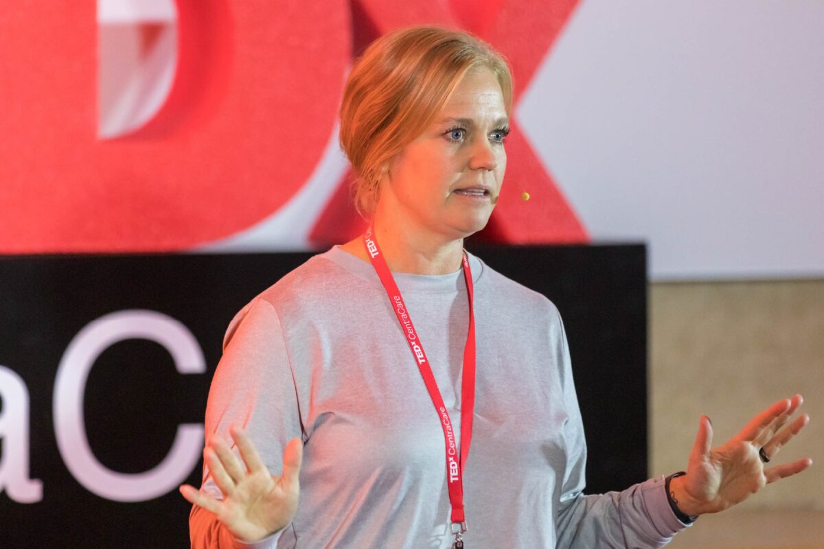 Photo of Bobbie Bertram, APRN, CNP, on the TEDxCentraCare stage