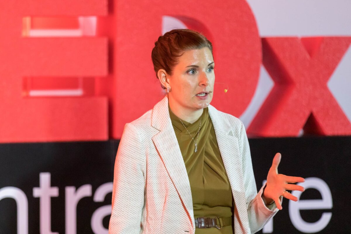 Photo of Jessie Roske, MD, on the TEDxCentraCare stage