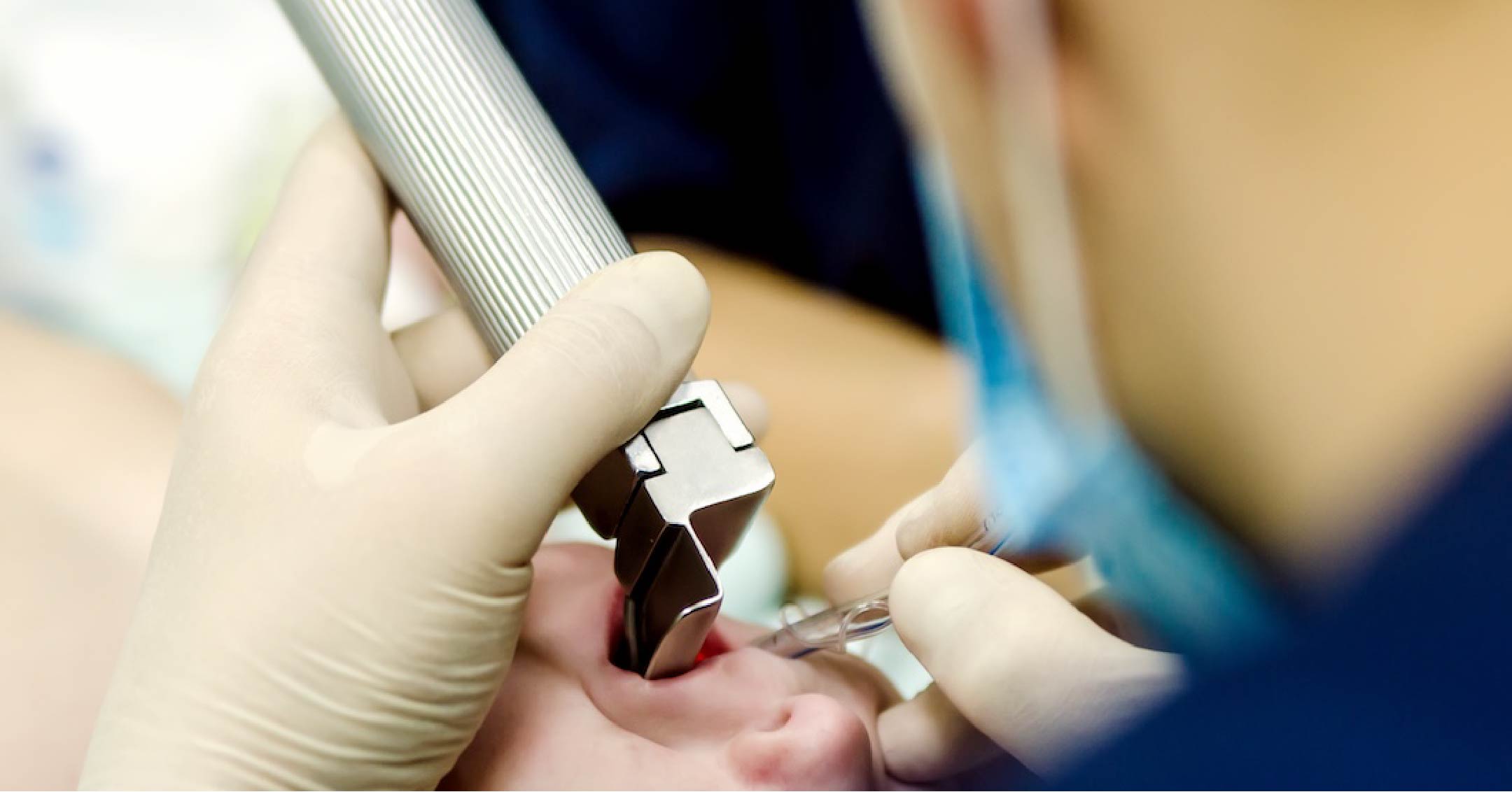 Photo of a caregiver preparing a patient for an airway related procedure