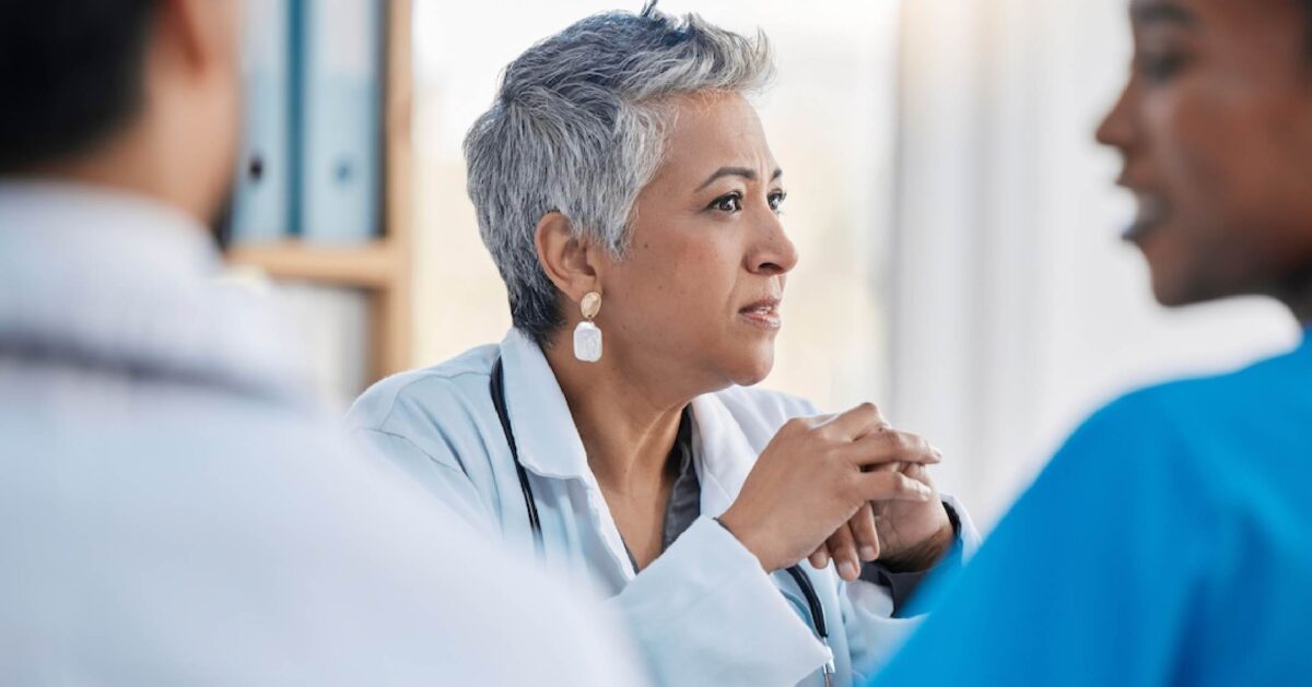 Photo of a female clinician leader in a meeting