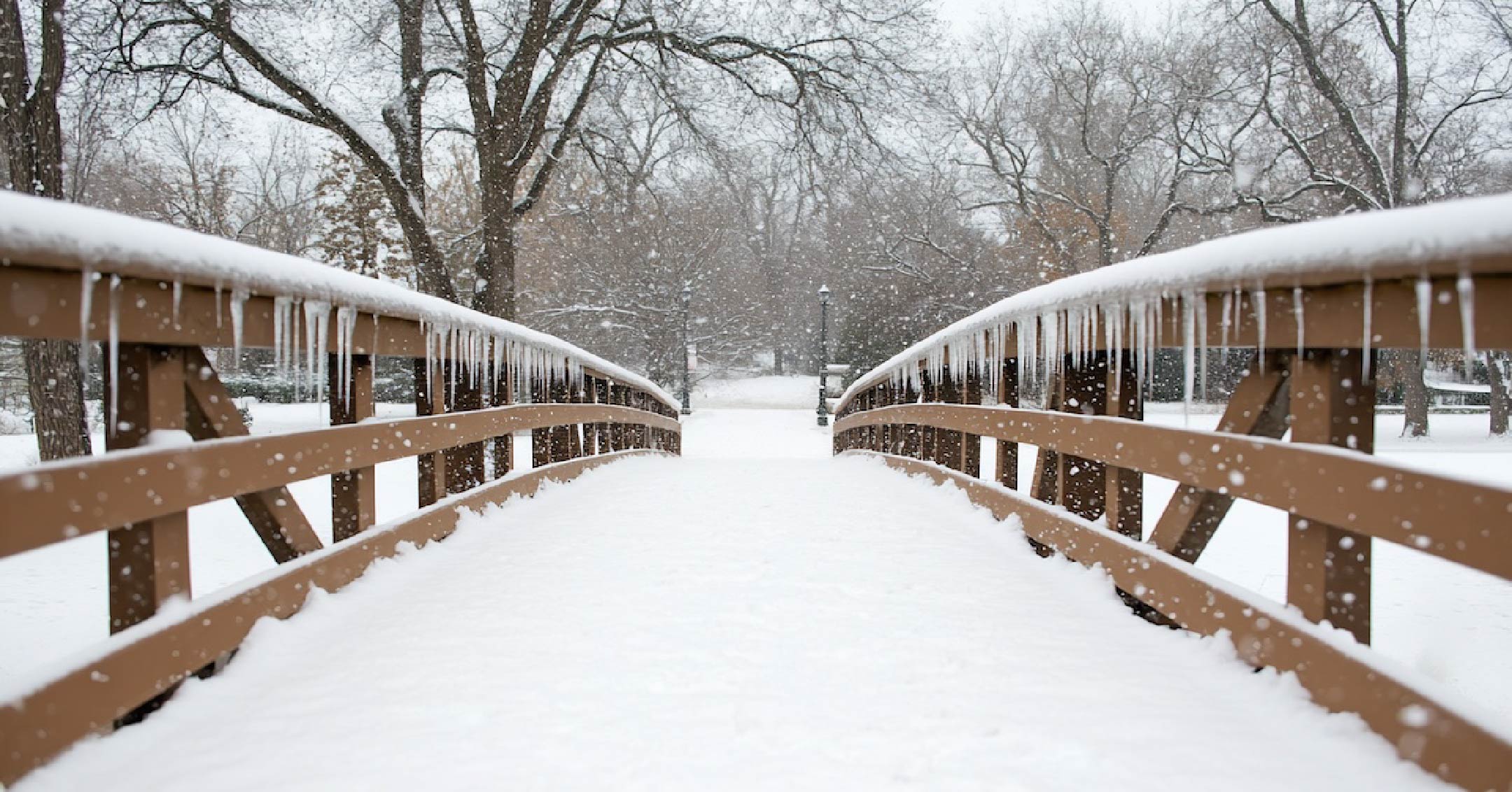 Photo of a snowy bridge in winter