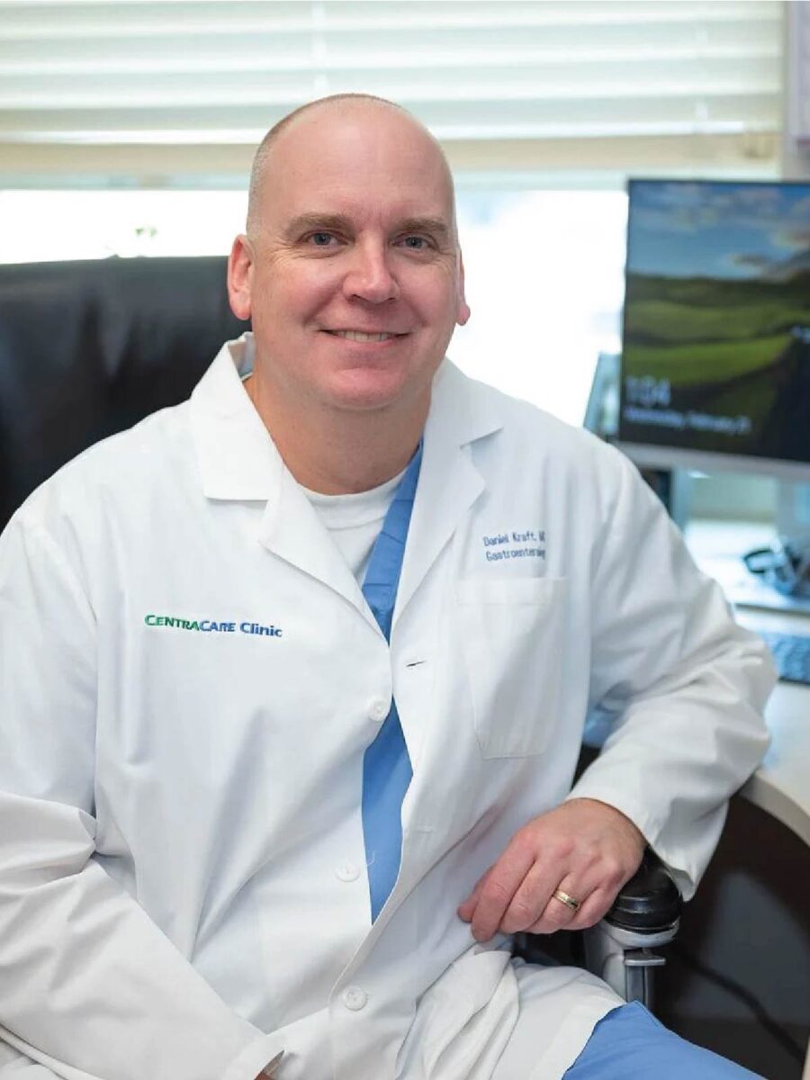 Photo of physician sitting at a desk