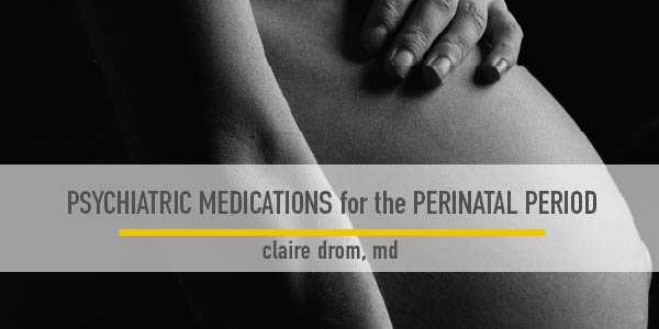 Side photo of a late-stage pregnant woman who is holding her naked belly