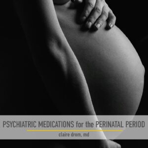 Side view photo of a pregnant woman holding her naked belly