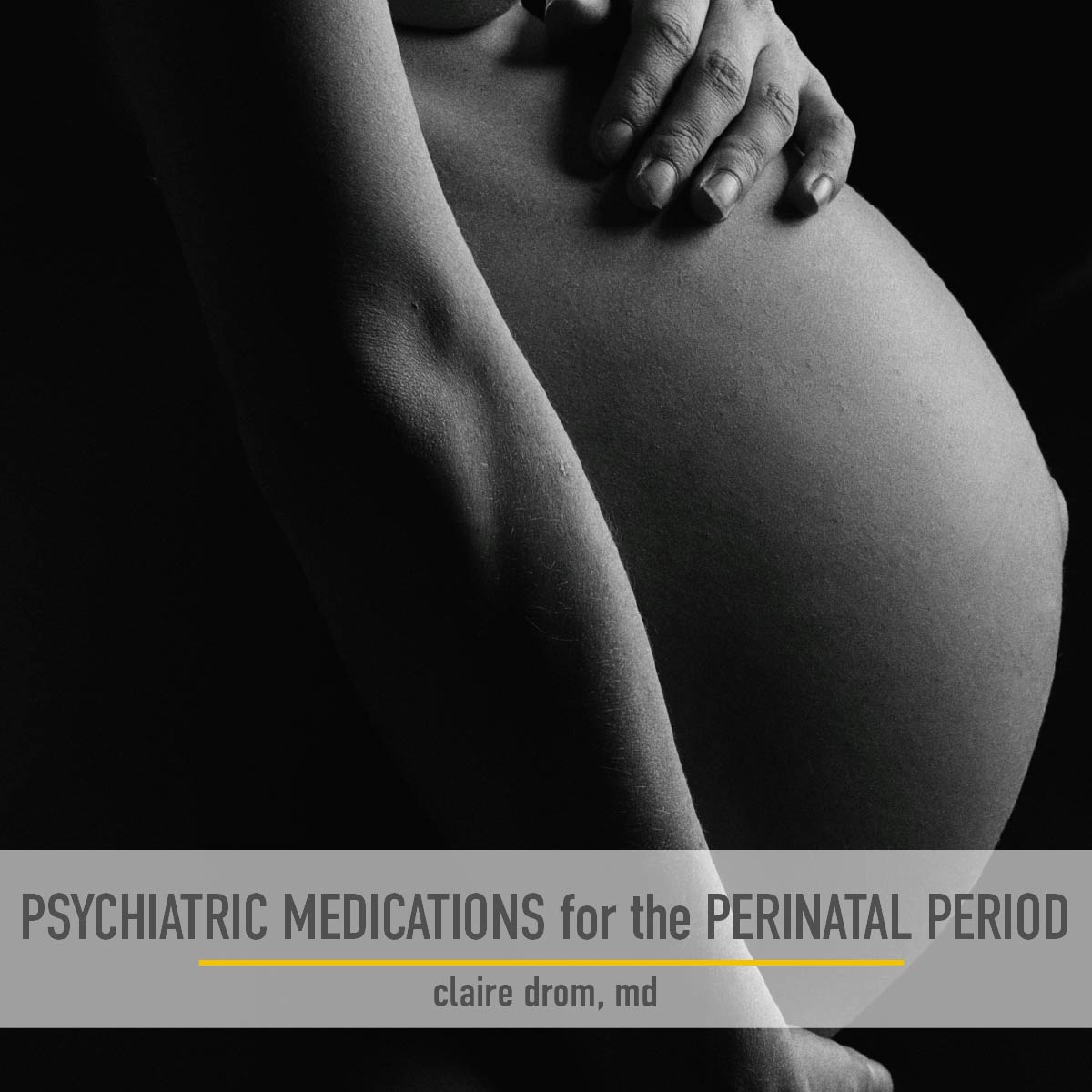 Side view photo of a pregnant woman holding her naked belly